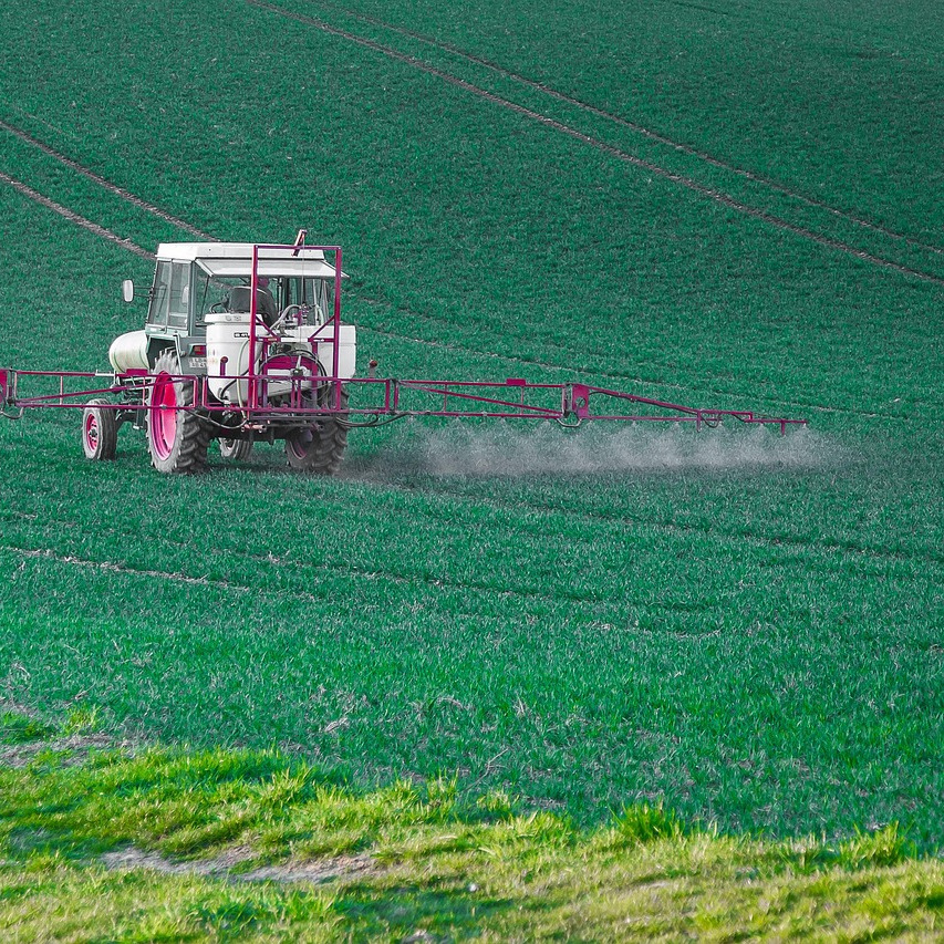 pest control technician spraying
